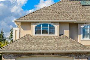 A home in Albertville, MN, after asphalt shingle roofing installations.